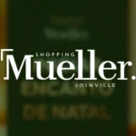 Miniatura de projeto em realidade aumentada para o Shopping Mueller Joinville, com logotipo branco em destaque sobre fundo verde.