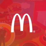 Miniatura do game em realidade virtual estilo “bater na marmota” desenvolvido para o McDonald’s, com logotipo branco centralizado sobre fundo vermelho.
