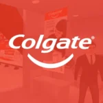 Miniatura do projeto Colgate no metaverso, com logotipo branco sobre fundo vermelho e ambiente virtual de estande 3D.